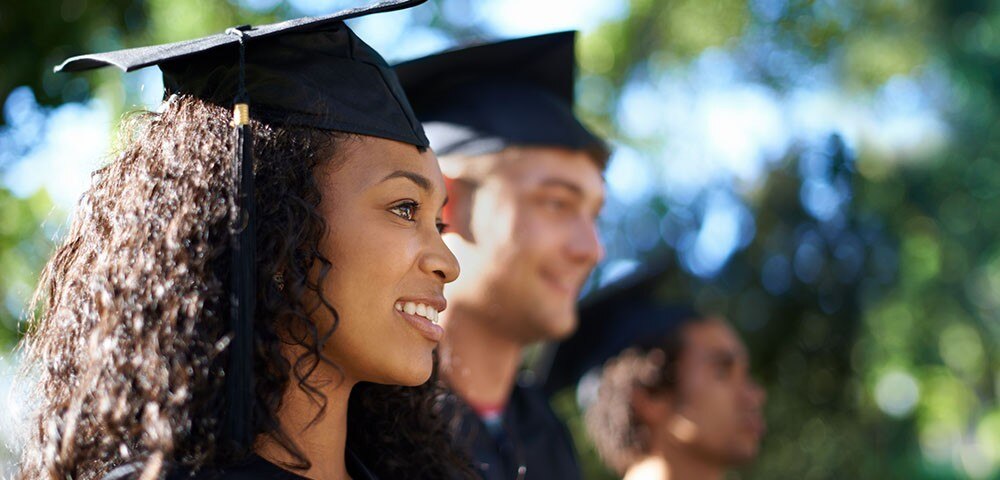 Woman graduate in cap and gown