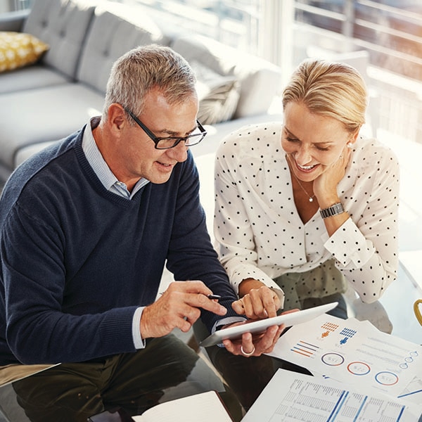 Man and woman looking at charts