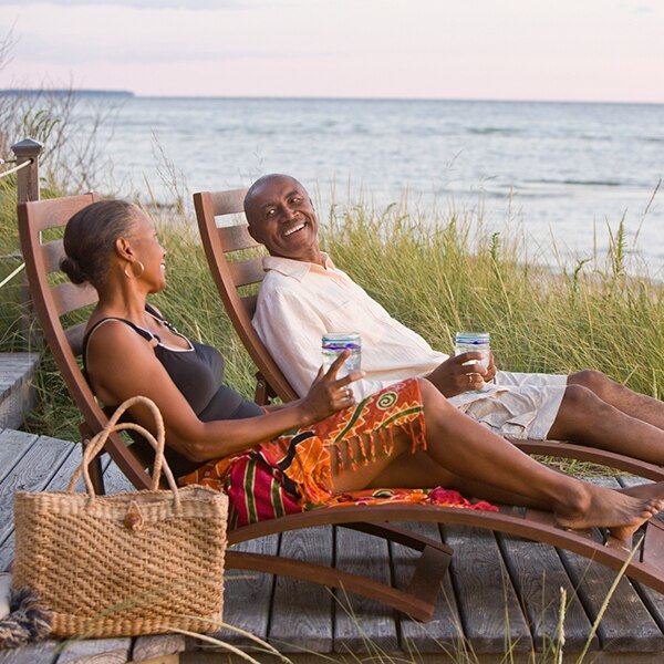 2 people relaxing on beach