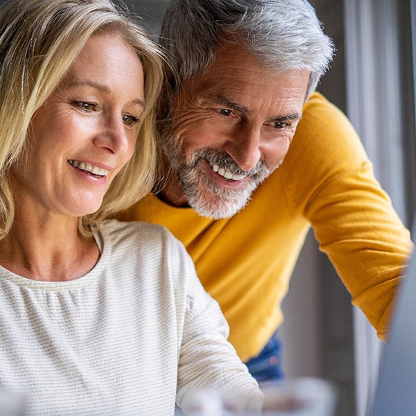 Couple looking at screen