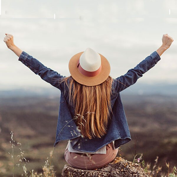 Woman with arms in victory pose