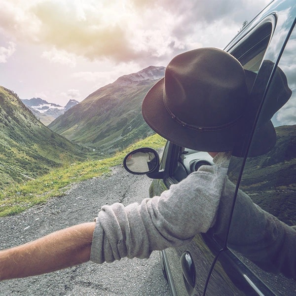 man in a car in the mountain