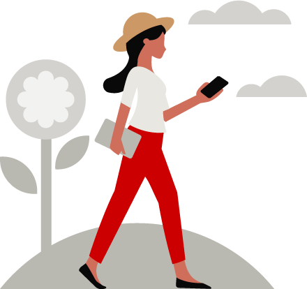 woman walking holding her phone
