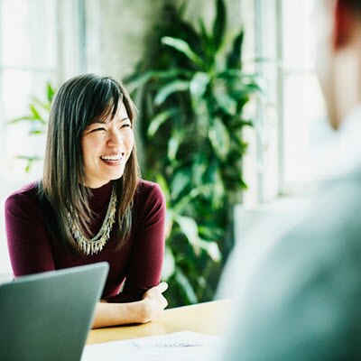 Smiling woman at table