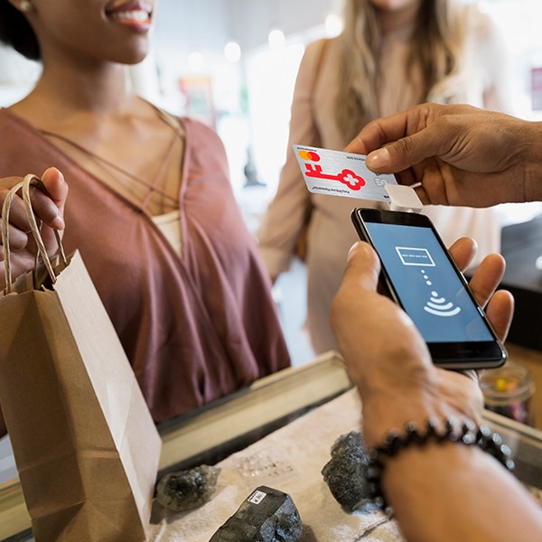 Woman using KeyBank card to pay