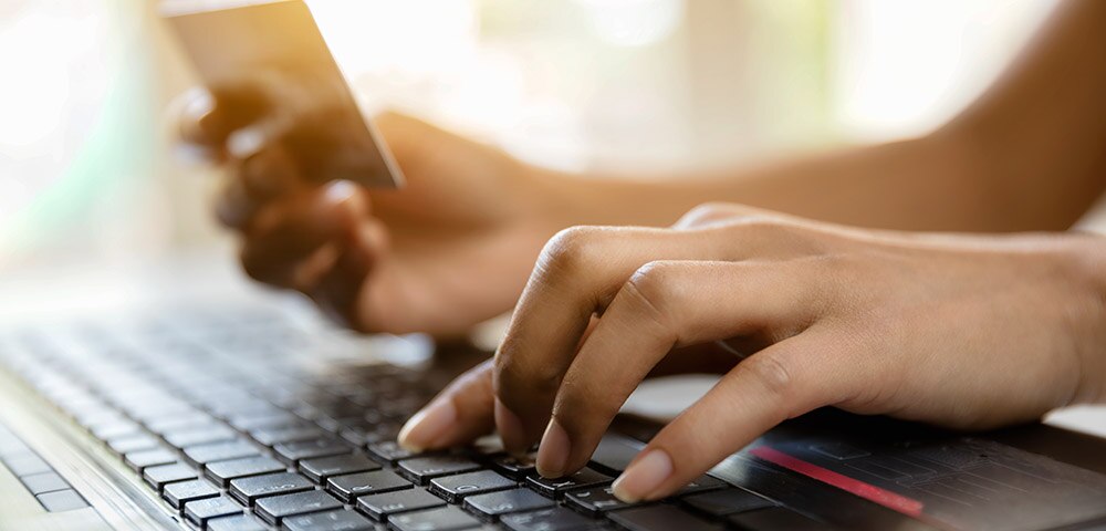Hand typing on a keyboard