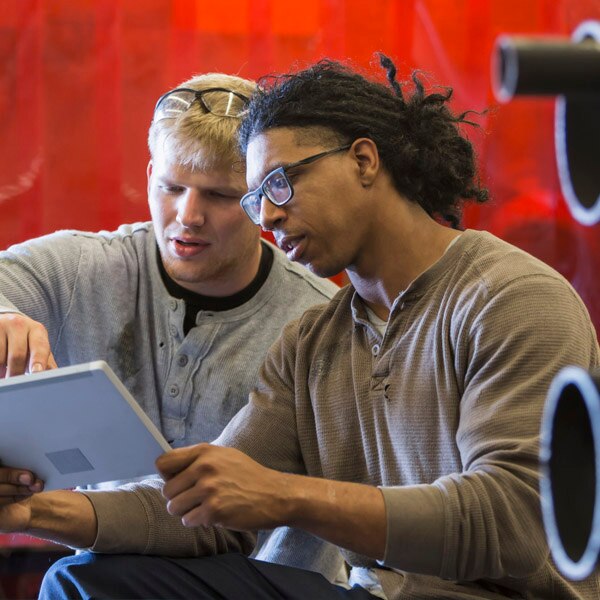 two guys on a tablet