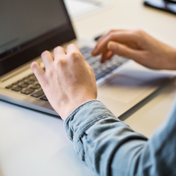 typing on a laptop