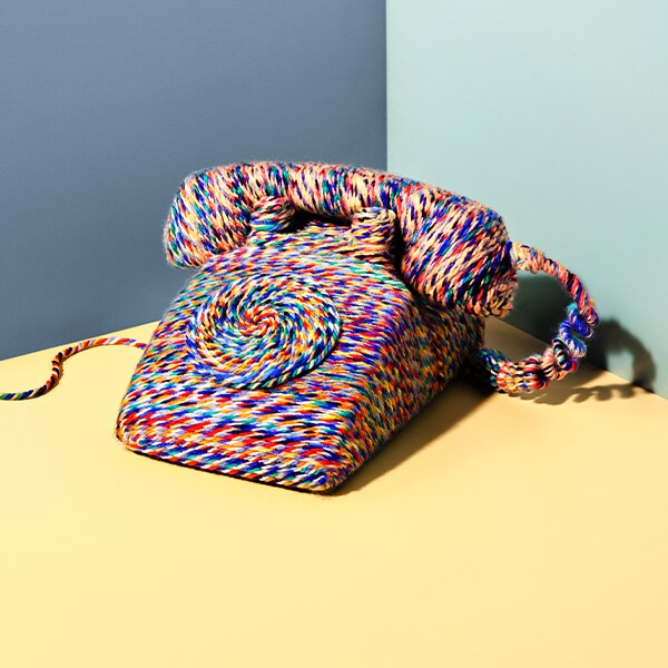 multicolor yarn wrapped around a telephone