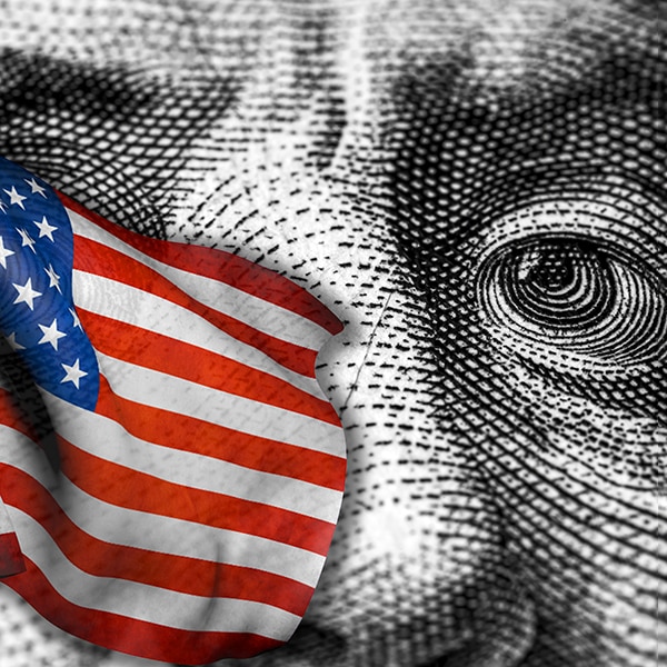USA flag and cash dollar bill