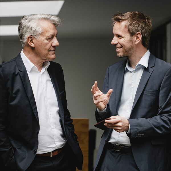 Two business men conversing