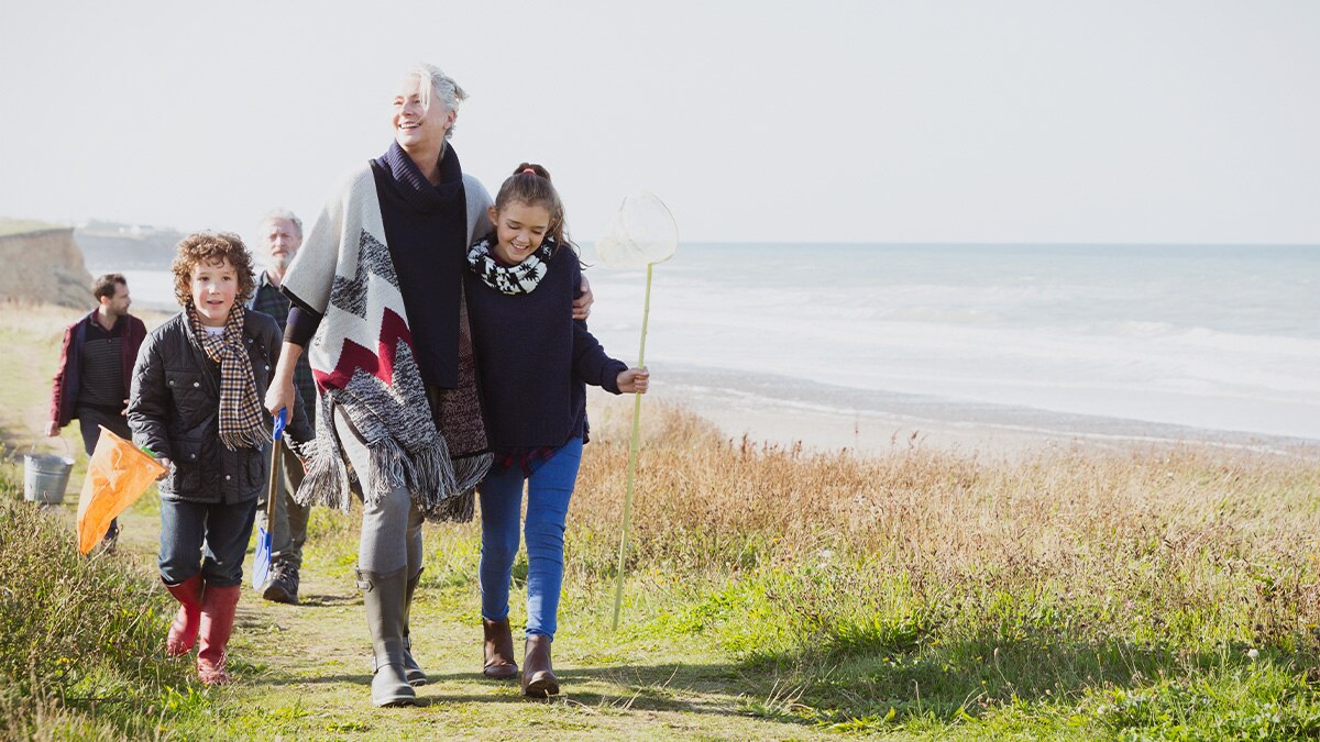 Family on hike by seashore 