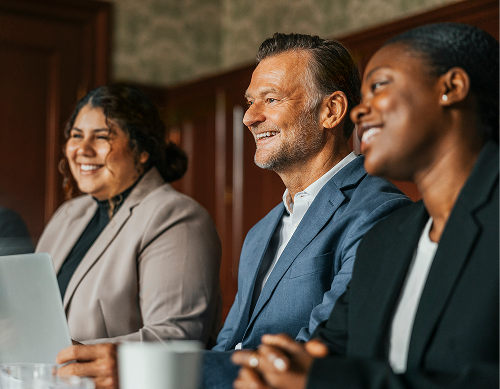 Group of smiling people at business meeting